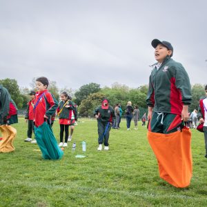 Student jumping in a sack race