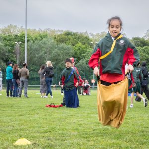 Student jumping in a sack race